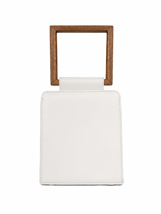 luxury handbag made from plantbased materials with a wooden handle