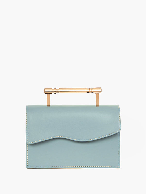 Light blue rectangular handbag with a flap closure and gold-tone bar handle.