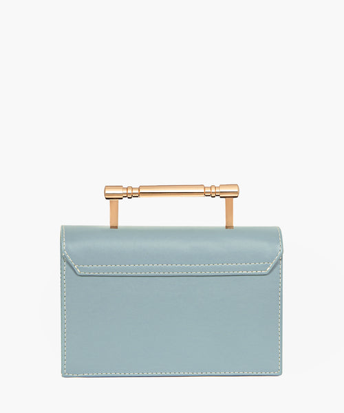 Light blue rectangular handbag with a flap closure and gold-tone bar handle.