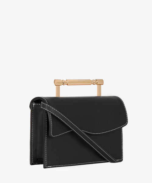 Side view of a deep black vegan handbag showcasing its refined, structured design and eco‑friendly material