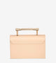 back view of luxury creme structured bag, vegan and PETA approved with gold top handle