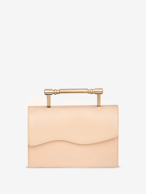 front view of luxury creme structured bag with gold top handle, featuring Mashu's signature wavy design on the front flap