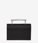 Chic black Saffiano leather handbag with a striking silver Art Deco top handle, blending modern luxury with vintage-inspired design for a standout look.