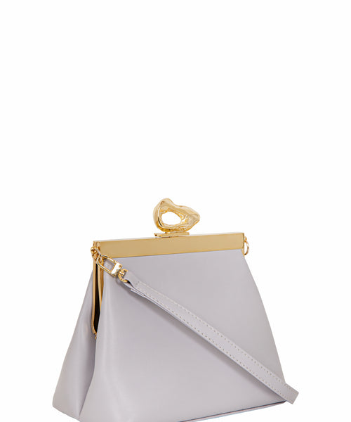 Side view of Nicole Lilac vegan handbag by Mashu, highlighting its minimalist design, soft lilac shade, and versatile adjustable strap for everyday elegance.