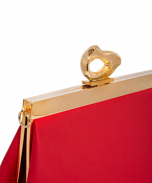 Close-up of 24ct gold-plated brass hardware on Mashu’s Nicole Red handbag, showcasing artisanal craftsmanship and sustainable design.