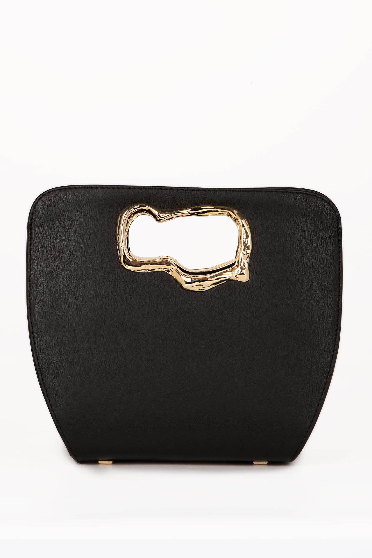 A minimalist, black leather handbag with a sculptural gold-tone handle opening, featuring an asymmetrical organic design.